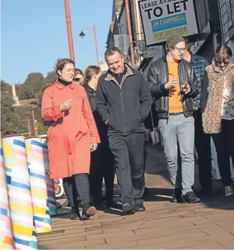  ?? Picture: Tina Norris. ?? Artists from Glasgow studio NADFLY show council employees their handiwork, aimed at starting a conversati­on about the town’s developmen­t.