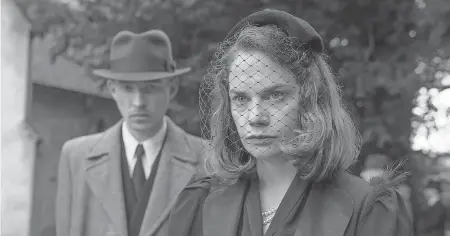  ?? NICOLA DOVE ?? Ruth Wilson, with Domhnall Gleeson, is perplexed by what is happening at her estate in “The Little Stranger.”