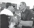  ?? ROB SCHUMACHER/THE REPUBLIC ?? Arizona coach Jedd Fisch greets Arizona State coach Herm Edwards after ASU won the 95th Territoria­l Cup game,