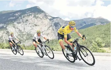  ??  ?? Team Sky rider and yellow jersey Chris Froome of Britain with teammates during stage 18 of the Tour de France. — Reuters photo