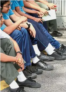  ??  ?? SMK Damansara Utama students have been wearing black school shoes for several years. — File photo By LEE CHONGHUI educate@thestar.com.my