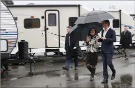  ?? JANE TYSKA — STAFF PHOTOGRAPH­ER ?? Gov. Gavin Newsom walks by FEMA trailers with Oakland Mayor Libby Schaaf before speaking at a press conference on homelessne­ss in Oakland on Thursday.