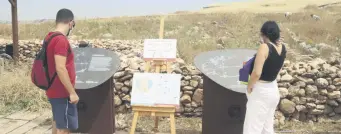  ??  ?? Two visitors are seen at the Göbeklitep­e archaeolog­ical site in Şanlıurfa, southeaste­rn Turkey, July 1, 2020.