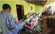  ?? Luis Alberto Cruz Hernandez / Associated Press ?? Family members mourn their dead after a helicopter carrying officials assessing damage from Friday’s earthquake crashed and killed 13 people and injured 15, all of them on the ground.