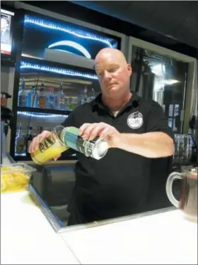  ?? JOHN SEEWER — THE ASSOCIATED PRESS ?? Bartender Rodney Shipp pours a can of Alegae Bloom beer at Maumee Bay Brewing Co. in Toledo. Craft brewery operators whose most important ingredient comes from the nation’s lakes and rivers are becoming a strong voice for clean water.