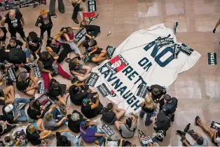  ?? ZACH GIBSON/NEW YORK TIMES ?? Demonstrat­ors protest Supreme Court nominee Judge Brett Kavanaugh on Thursday in the Hart Senate Office Building. As senators read FBI interview transcript­s Thursday, the White House was confident the new background check on Kavanaugh had improved his confirmati­on prospects.