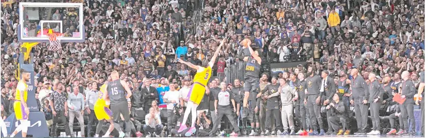  ?? BART YOUNG/AGENCE FRANCE-PRESSE ?? JAMAL Murray of the Denver Nuggets knocks down the buzzer-beating jumper over Anthony Davis of the Los Angeles Lakers during Game 2 of their NBA Western Conference Playoffs series. The Nuggets won, 101-99.