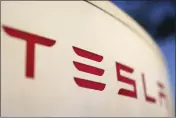  ?? CHRIS CARLSON — THE ASSOCIATED PRESS FILE ?? The logo for a Tesla Supercharg­er station in Buford, Ga., is seen April 22, 2021.