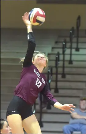  ?? PETE BANNAN – MEDIANEWS GROUP ?? Garnet Valley’s Caitlyn Hagerty uncoils an overhead slam against Strath Haven Wednesday night.