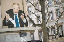  ?? AFP-Yonhap ?? This file photo taken on March 22 shows a painting depicting Russian President Vladimir Putin killing a dove, at Place de la Paix in Lyon, central eastern France.