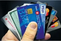  ?? RYAN REMIORZ/ THE CANADIAN PRESS FILES ?? Canadians owe nearly $ 1.64 for every $ 1 in annual disposable income they earn, with much of that debt linked to credit cards.