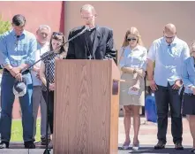  ?? ROBERTO E. ROSALES/JOURNAL ?? Archbishop John Wester leads a group in prayer during a June event at the National Hispanic Cultural Center.