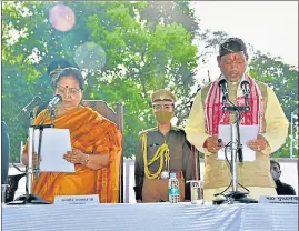  ?? HT PHOTO ?? Newly appointed chief minister Tirath Singh Rawat takes oath in Governor house in Dehradun on Wednesday evening.