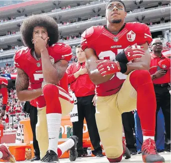  ?? MARCIO JOSE SANCHEZ/THE ASSOCIATED PRESS FILES ?? Former San Francisco 49ers safety Eric Reid, right, has filed a grievance against the NFL, alleging he remains unsigned as a result of collusion by owners. Reid joined Colin Kaepernick in kneeling during the anthem in 2016 to protest systemic oppression.