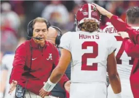  ?? Tom Pennington, Getty Images ?? Sophomore quarterbac­k Jalen Hurts and coach Nick Saban are back in the national championsh­ip game with the Alabama Crimson Tide.