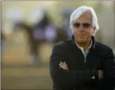  ?? CHARLIE RIEDEL — THE ASSOCIATED PRESS ?? Trainer Bob Baffert watches a morning workout at Churchill Downs on Tuesday in Louisville, Ky. The 144th running of the Kentucky Derby is scheduled for Saturday.