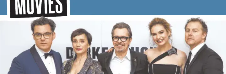  ?? PHOTO BY VIANNEY LE CAER/INVISION/AP ?? Joe Wright, Dame Kristin Scott Thomas, Gary Oldman, Lily James and Samuel West pose for photograph­ers upon arrival at the premiere of the film 'Darkest Hour' in London.