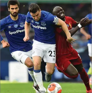  ??  ?? Seamus Coleman of Everton outmuscles Sadio Mane of Liverpool during the Merseyside derby on Sunday.