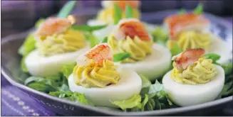  ?? Photos, Adrian Lam, Victoria Times Colonist ?? Stuffed Eggs with Curry, Crab and Snow Peas can be served at brunch or brought to a potluck.