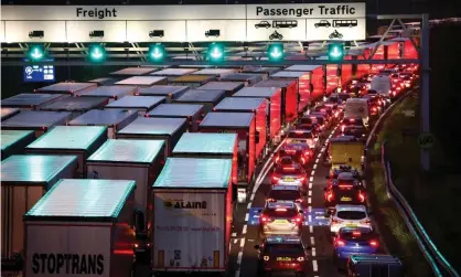  ?? ?? Cars and trucks queue at the entrance of the Eurotunnel in Folkestone, Kent. Photograph: Henry Nicholls/Reuters