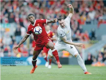  ?? — Reuters ?? Liverpool’s Georginio Wijnaldum in action with Manchester United’s Phil Jones.
