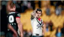  ?? PHOTOS: GETTY IMAGES. ?? Roosters halfback Mitchell Pearce hardly covered himself in glory at Mt Smart Stadium.