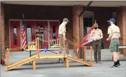  ??  ?? A wooden bridge is important to the Crossover Ceremony as it symbolizes the transition from a younger group to an older group in which the boys will take on new challenges and learn new skills.