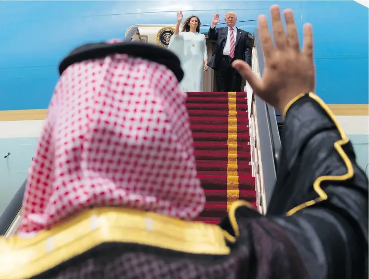  ?? BANDAR AL- JALOUD / SAUDI ROYAL PALACE / AFP PHOTO ?? U. S. President Donald Trump and Melania Trump wave as they board Air Force One before leaving Riyadh last May.