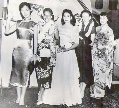  ??  ?? The Philippine candidate, Teresita Torralba Sanchez (center), with Misses Hong Kong, Hawaii, Australia and Japan. The 1952 Miss Universe souvenir program (top) and a vintage maiden print ad for the 1952 pageant (below).