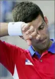  ?? Associated Press ?? “You feel constantly dehydrated,” said world No. 1 Novak Djokovic.