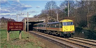  ?? MEL THORLEY ?? SIGN OF THE TIMES: Does anyone know when the big signs at Rugby North Junction and Weaver Junction disappeare­d? The latter is seen in Mick Langton’s photo on February 29, 1988 as No. 86219 passes with the 1M05/08.10 Glasgow-Euston. 29.02.1988.