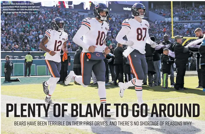  ?? GETTY IMAGES ?? Receiver Allen Robinson (from left), quarterbac­k Mitch Trubisky and tight end Adam Shaheen run onto the field before the game against the Eagles.