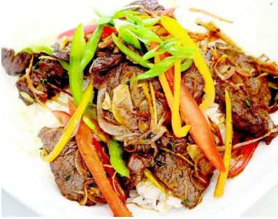  ?? PHOTOS BY LIONEL ROOKWOOD/PHOTOGRAPH­ER ?? The scrumptiou­s beef bowl, made with ginger soy beef bone and jasmine rice is a must-have from Food Trucks of Jamaica.