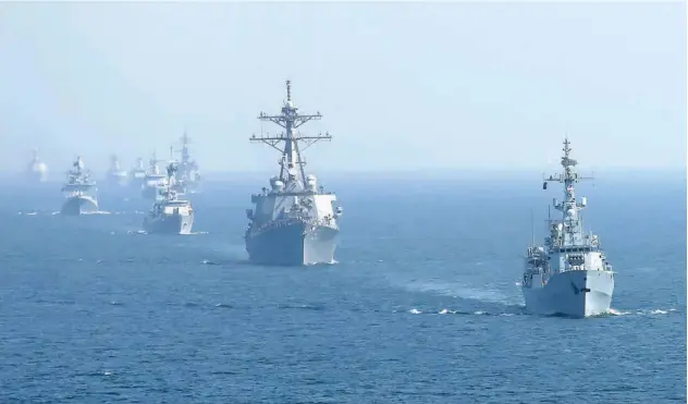  ?? Associated Press ?? Warships from various countries take part in a multinatio­nal military exercise in the Arabian Sea near Karachi on Monday.
