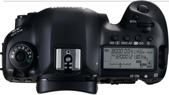  ??  ?? Unlike Canon’s top-end 1D X Mk II model, the 5D Mk IV features a convention­al Mode dial on the top plate, with three Custom user settings