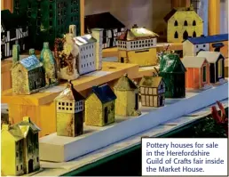  ??  ?? Pottery houses for sale in the Herefordsh­ire Guild of Crafts fair inside the Market House.