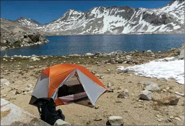  ?? Courtesy photo/JIM WARNOCK ?? Warnock’s tent on the shore of Wanda Lake where he camped at 11,434 feet. Warnock took a quick dip in the lake to wash off the trail grunge.