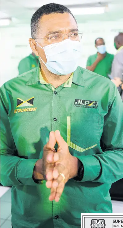  ?? GLADSTONE TAYLOR/MULTIMEDIA PHOTO EDITOR ?? Andrew Holness addresses the media at a Jamaica Labour Party press conference on Thursday. The JLP beat the PNP 49-14 on election day.