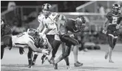  ?? MICHAEL LAUGHLIN/ STAFF FILE PHOTO ?? Hallandale RB Taj McGowan, center, rushed for 130 yards and five touchdowns in their preseason game last week.