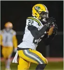  ?? DANA JENSEN/THE DAY ?? New London’s Clayton Smith, making an intercepti­on against Fitch during a high school football game on Nov. 15, 2019, was slated to compete for the boys’ track team this spring. He will continue his football career at Nichols College.