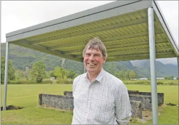  ??  ?? Glenfinnan Estate manager Alistair Gibson and the newly constructe­d pavilion at the games field. IF-F32-Glenfinnan-Pavilion