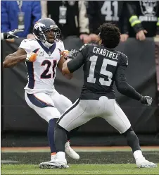  ?? AP PHOTO ?? Oakland receiver Michael Crabtree and Denver cornerback Aqib Talib (21) were suspended two games each without pay for fighting during Sunday’s game.