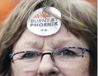  ?? JUSTIN TANG / THE CANADIAN PRESS ?? Shirley Taylor wears a ‘Burnt by Phoenix’ sticker on her forehead during a rally in Ottawa earlier this year.