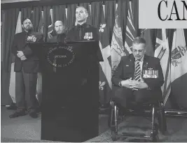  ?? SEAN KILPATRICK / THE CANADIAN PRESS ?? Afghanista­n veteran and retired major Mark Campbell, right, joins a group of veterans as they speak on Parliament Hill on Thursday. No group has the power to inflict damage on a sitting government like irate veterans, columnist John Ivison writes.