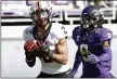  ?? RON JENKINS — THE ASSOCIATED PRESS ?? Oklahoma State wide receiver Tylan Wallace catches a touchdown pass in front of TCU safety Atanza Vongor on Dec. 5, 2020in Fort Worth, Texas.