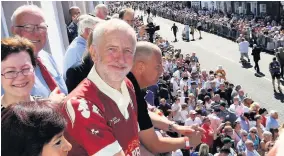  ??  ?? Jeremy Corbyn watching the marching bands