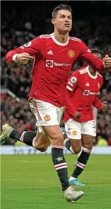  ?? MARTIN RICKETT / DPA ?? Hier jubelt Cristiano Ronaldo im Dress von Manchester United. Bald schon im Bayern-Trikot?