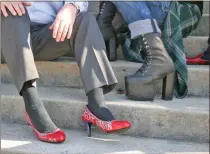  ??  ?? Robert Smyth’s trademark red credit union heels and Steven White’s intimidati­ng platform boots are just two of the many pairs of shoes being worn by men for the Walk a Mile event that will take participan­ts from Rotary Plaza, down to 2nd Avenue and...