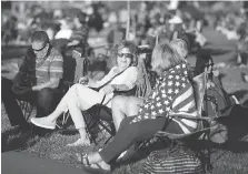  ??  ?? Crowds gather on the lawn at Dieppe Park on Monday as visitors claim a spot to view the annual Ford Fireworks on the Detroit River.