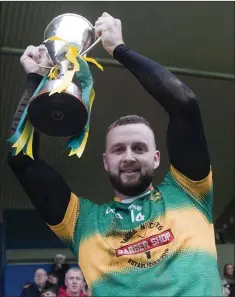  ??  ?? Kilcoole captain Danny Kavanagh lifts the cup.